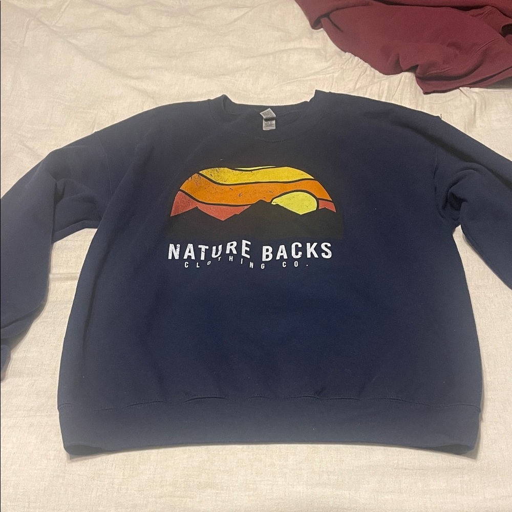 2 Nature Backs sweaters. 1 navy blue, 1 maroon